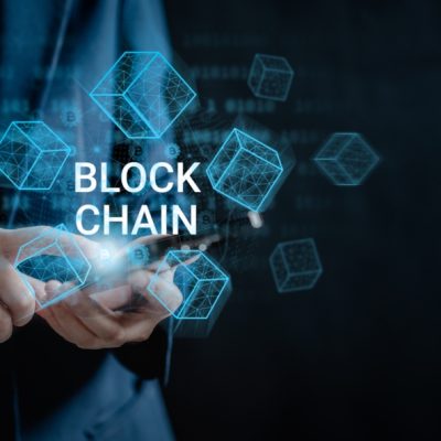 Businesswoman,Use,A,Smartphone,Connecting,To,Blockchain,Global,Networking,,Token